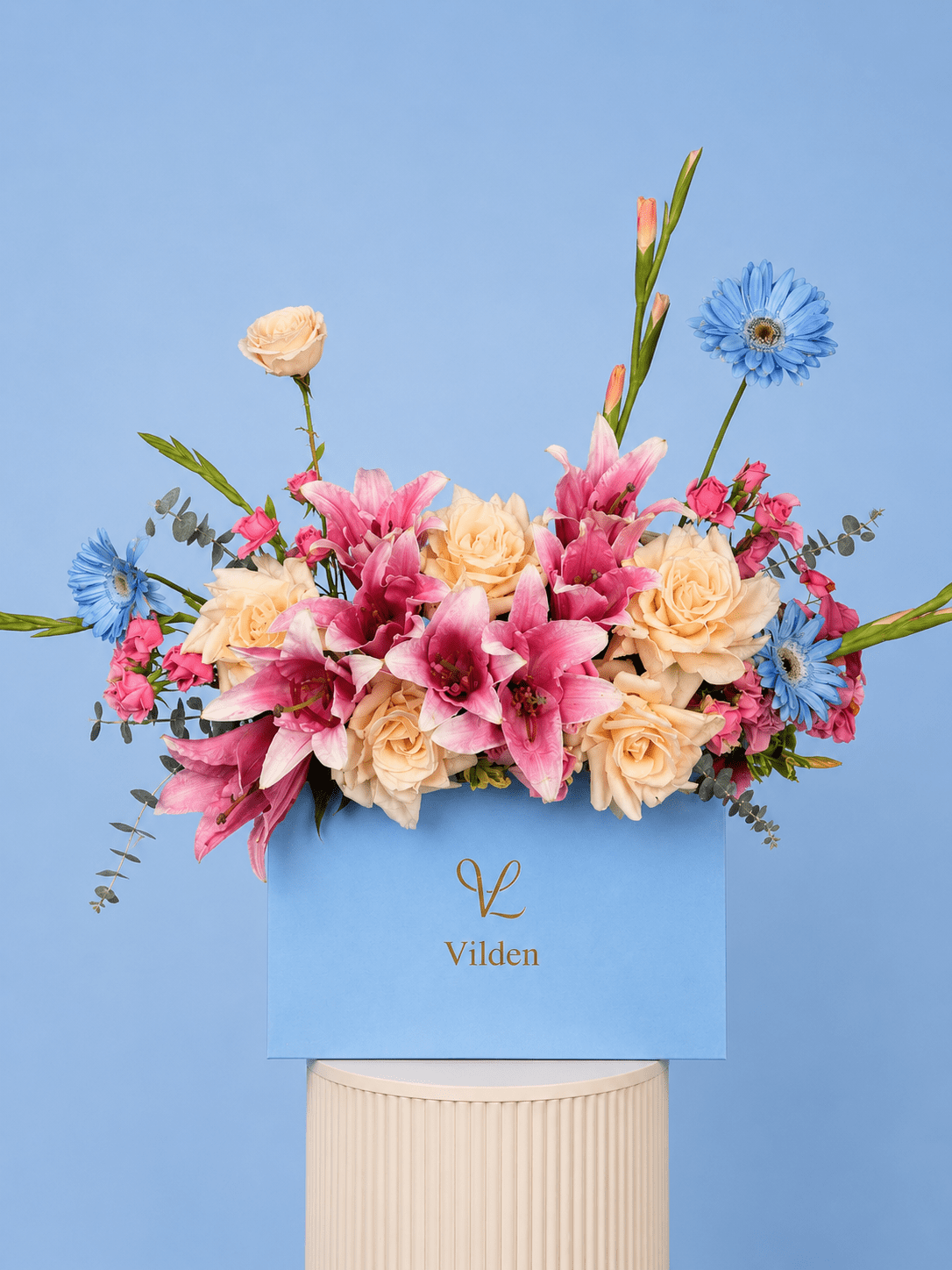 Handcrafted with premium blooms, Petal Sky embodies calm elegance. Delicate lilies and roses in a serene arrangement.