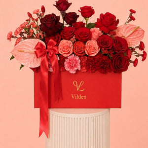 Crimson Serenade red rose flower box with pink anthurium, and Vilden luxury floral design.