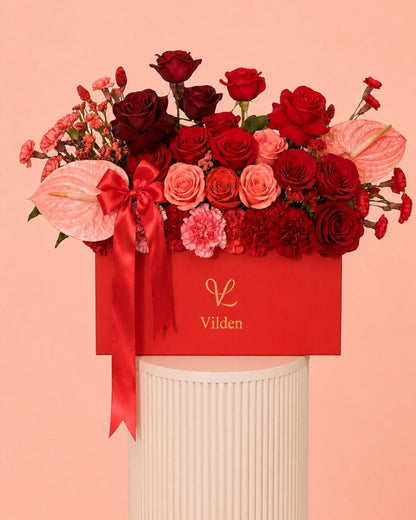 Crimson Serenade red rose flower box with pink anthurium, and Vilden luxury floral design.