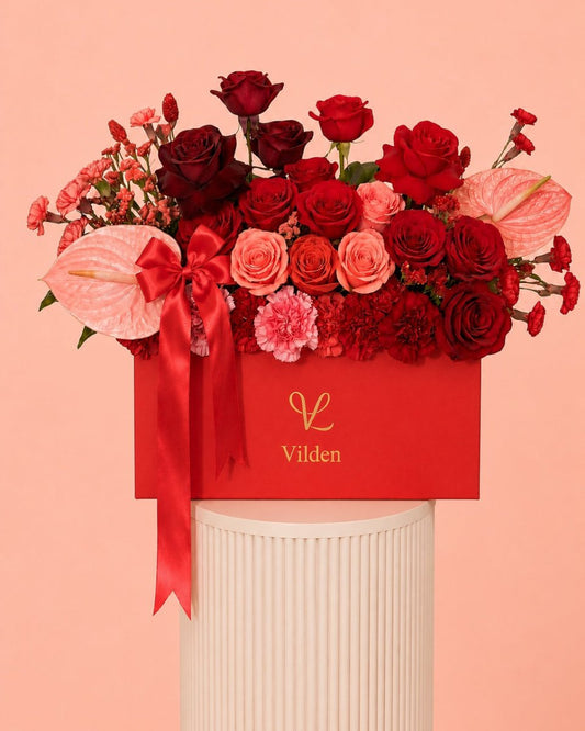 Crimson Serenade red rose flower box with pink anthurium, and Vilden luxury floral design.