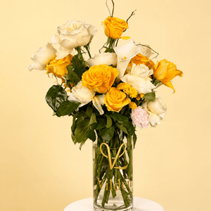 Lemon Cream: A burst of sunshine and soft cream. Yellow roses mixed with cream blooms for a refined gift that brings joy.