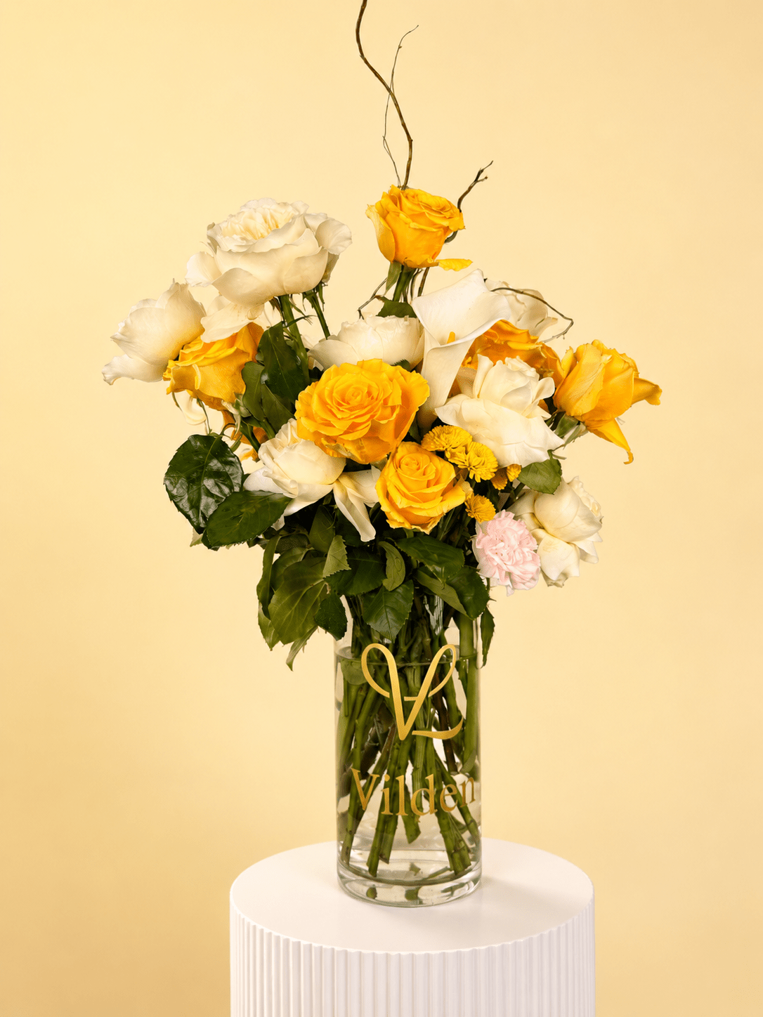 Lemon Cream: A burst of sunshine and soft cream. Yellow roses mixed with cream blooms for a refined gift that brings joy.