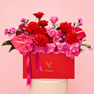 Amore Vivace luxury flower box with red roses, pink roses, carnations, and pink anthuriums in a bold red Vilden box