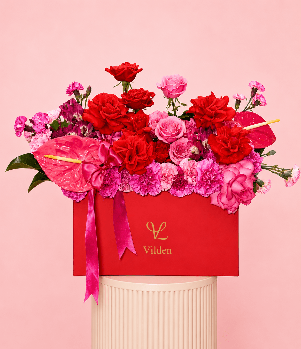 Amore Vivace luxury flower box with red roses, pink roses, carnations, and pink anthuriums in a bold red Vilden box