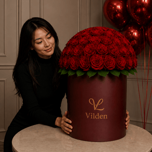 Rose Sphere is an elegant flower box in a burgundy Vilden box with deep red roses