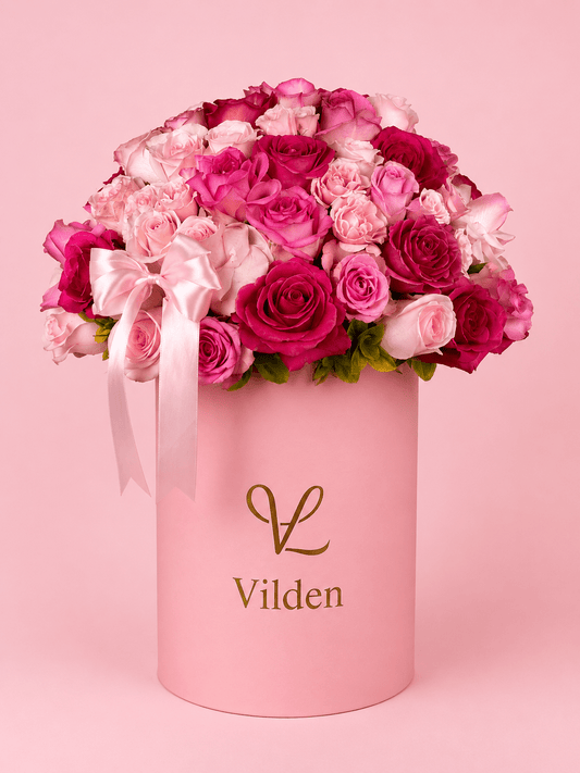 Blush Crescendo is a flower arrangement with fresh pink blooms in an elegant floral design