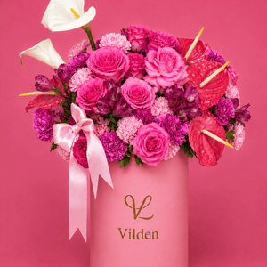 Pink Rhapsody floral arrangement with vivid pink blooms in a luxury flower box